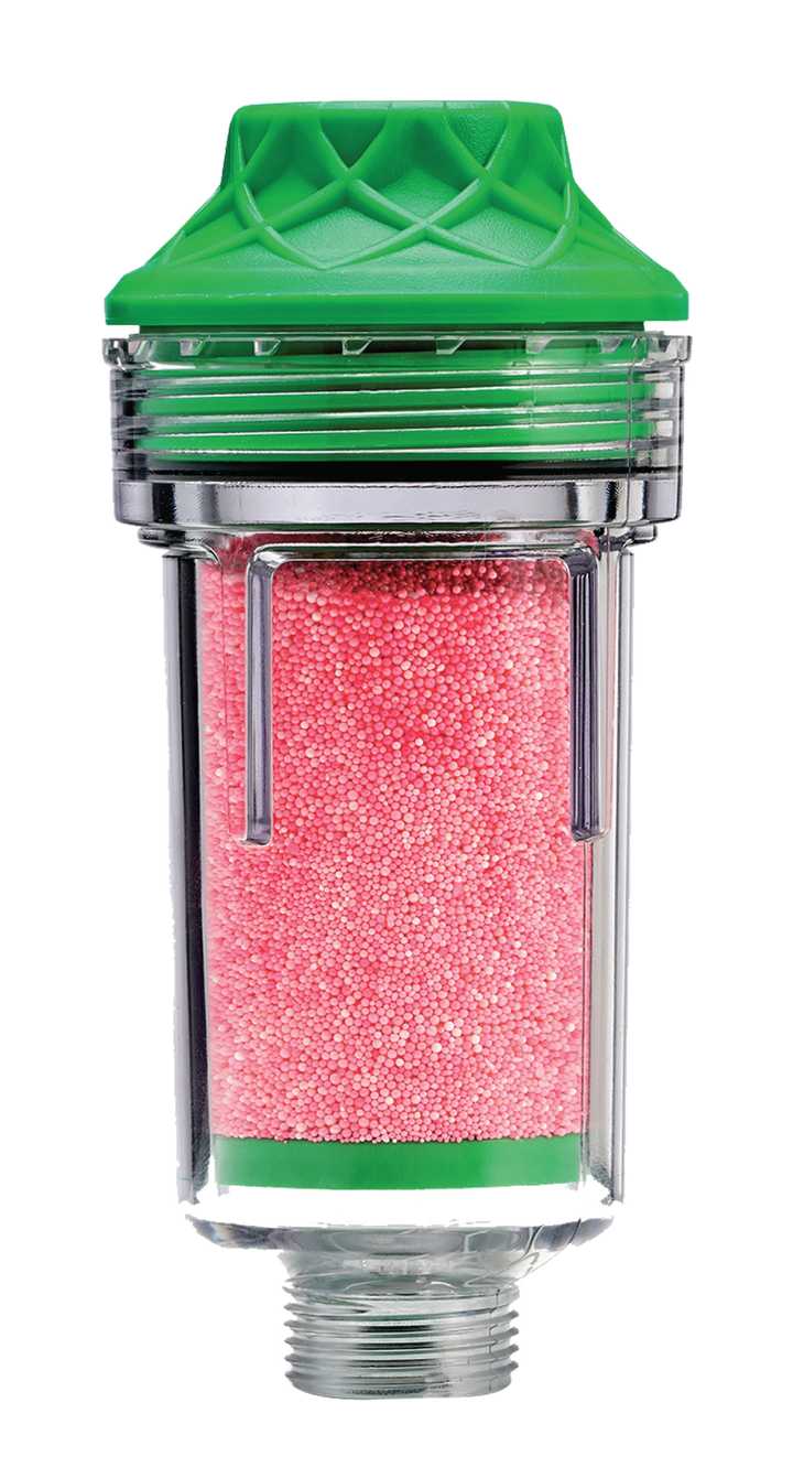 A transparent water filter cartridge with a green cap, filled with small pink filtration beads, isolated on a white background.