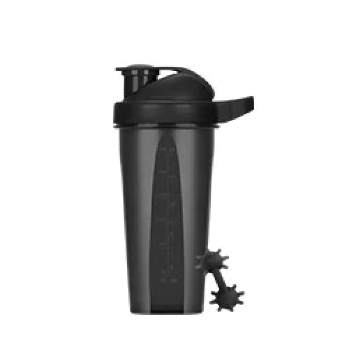 A black shaker bottle with a flip-top lid, measurement markings on the side, and a separate mixing ball resting next to the base.