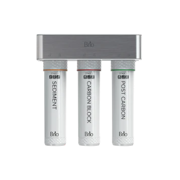 Three cylindrical water filter cartridges labeled Sediment, Carbon Block, and Post Carbon hang vertically from a metallic Brio filter system mounted on a light grey background.