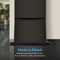 A close-up of the bottom half of a sleek, black Ice Maker + Water Dispenser Cooler Base - 320 Series with a glossy floor and indoor plants. Text reads: Made to Match. Pairs seamlessly with your 320 Series cooler for a clean, cohesive look.