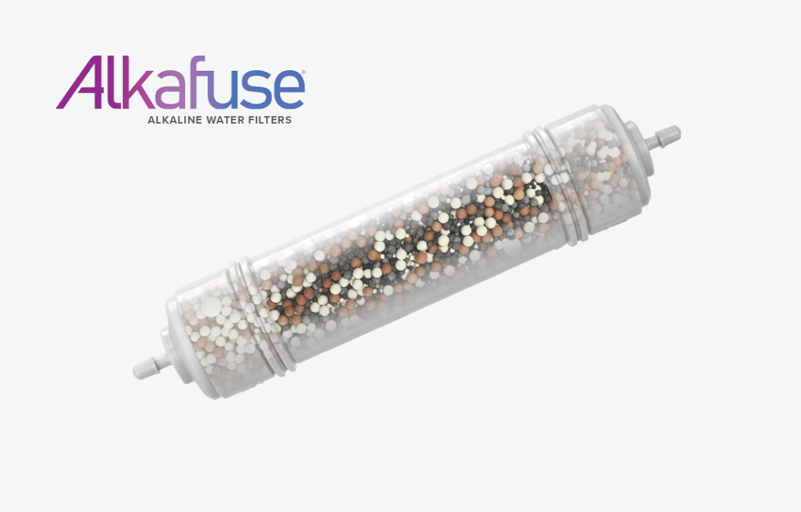 Alkafuse alkaline water filter cartridge with transparent housing, filled with mixed mineral beads in white, brown, and black colors, shown on a white background with the Alkafuse logo in purple and blue.