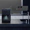 A Touchless 3-Stage Black Stainless Countertop Water Cooler from the Moderna Series is positioned on a kitchen counter. An inset reveals a close-up of the electronic controls, showcasing features like an advanced 3-stage filtration system, LED night light, LED digital clock, and display icons for both hot and cold water functions.