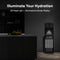 Modern kitchen featuring the Black Stainless Ultrafiltration Bottleless Water Dispenser - 520, equipped with an LED night light and illuminated indicator. A bowl of lemons rests on the counter, while state-of-the-art ultrafiltration systems are visible in the open lower panel of this bottleless water dispenser.