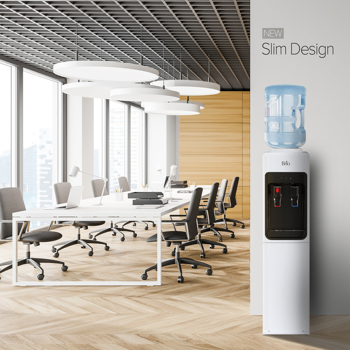 A modern office featuring white desks, chairs, expansive windows, and the White Top Load Water Cooler - 320 Sim Series with a NEW Slim Design prominently displayed in the foreground. The bright space is accented by wood finishes and stylish lighting.
