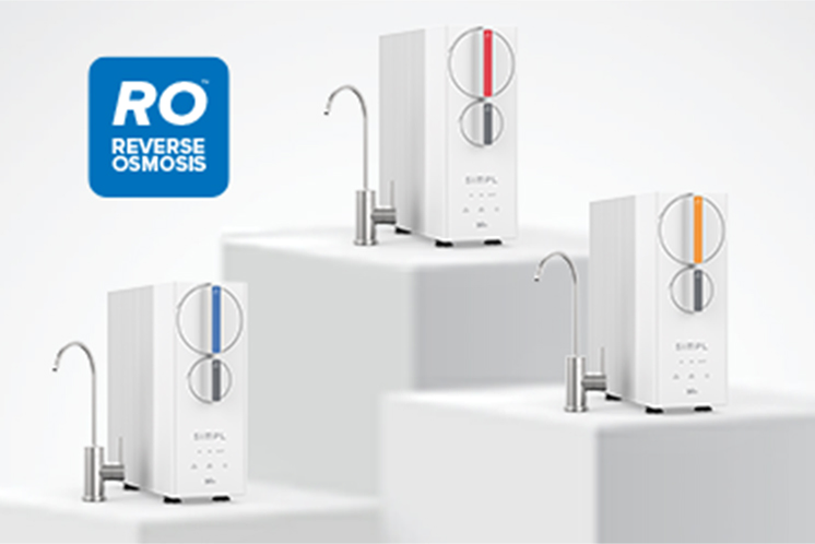 Three Brio SIMPL reverse osmosis water filtration units displayed on white platforms, each with an attached faucet and color-coded dials in blue, red, and orange. A blue "RO Reverse Osmosis" label appears in the top left corner.