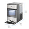 The Countertop Nugget Ice Maker - 740i boasts a modern silver and black exterior with a clear viewing window to showcase the ice inside, and includes a handy metal scoop placed on the tray. Measuring 16.53 inches (42 cm) in height, 18.9 inches (48 cm) in depth, and 10.04 inches (25.5 cm) in width, this high-capacity appliance offers both convenience and style for your countertop setup—ensuring you always have fresh nugget ice on hand.
