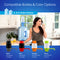 A woman drinks water in a bright kitchen using the Manual Water Bottle Pump - Grey & Blue on a 5-gallon bottle. Four color options—black, red, orange, and green—are also available, each labeled with its product code.
