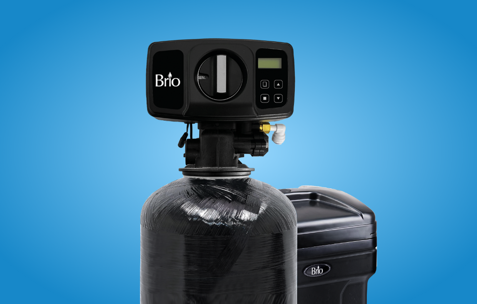 Close-up of Brio water softener system featuring black resin tank and digital valve control with LCD screen for programmable settings.
