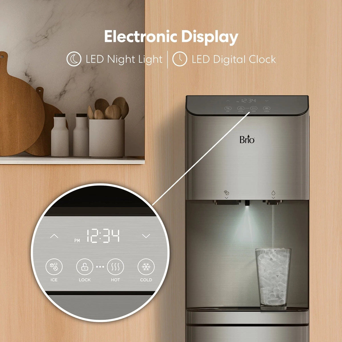 A Moderna 720 Ice Bottom Load Bullet Ice & Hot/Cold Water Stainless Steel Dispenser features an electronic display showing 12:34 PM, a digital clock, and an LED night light. A glass is being filled with ice from the unit’s convenient bullet ice dispenser, while kitchen shelves with jars and cutting boards can be seen in the background.