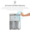 A hand hovers over the sensor of the Touchless 4-Stage Reverse Osmosis Bottleless Water Cooler – Moderna Series, activating cold water dispensing without contact. Water flows into a glass beneath, while text highlights the innovative single-sensor technology of this bottleless water cooler.