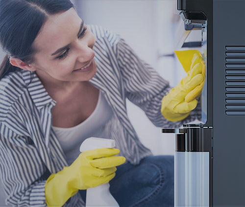 woman cleans brio water dispenser