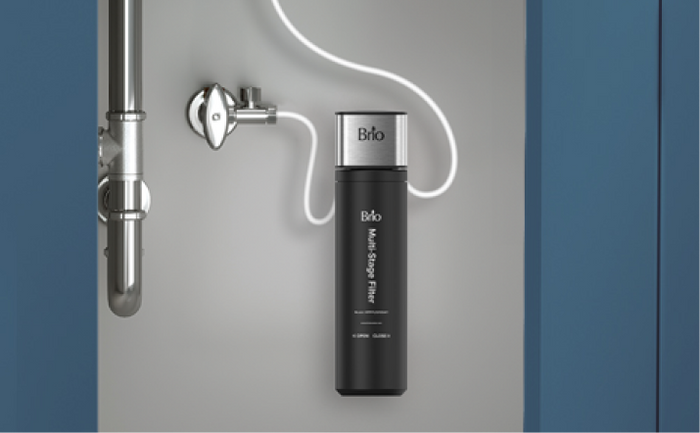 Brio single housing undersink water filter installed beneath a sink with visible white tubing and chrome plumbing.