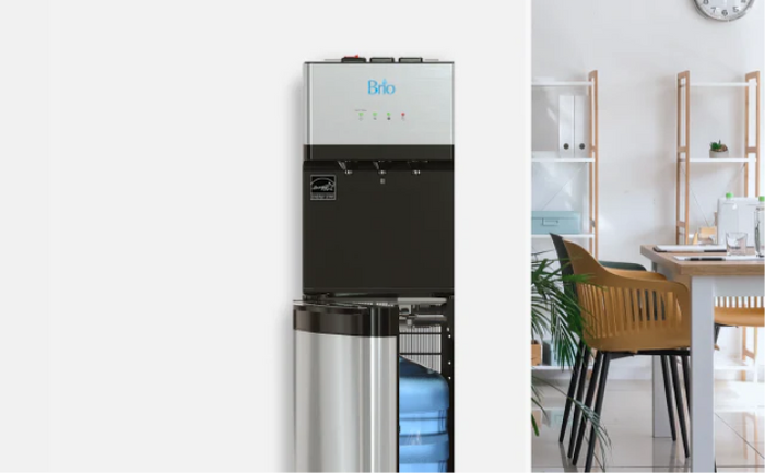 Brio bottom load bottled water cooler with the door open, showing the water bottle compartment in a bright kitchen setting.