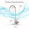 A diagram of the Modern Series Water Faucet - Chrome with labeled measurements: height 10.36 in (26.3 cm), reach 4.92 in (12.5 cm), width 1.07 in (2.7 cm), base height 2.76 in (7.0 cm); blue water waves appear in the background.