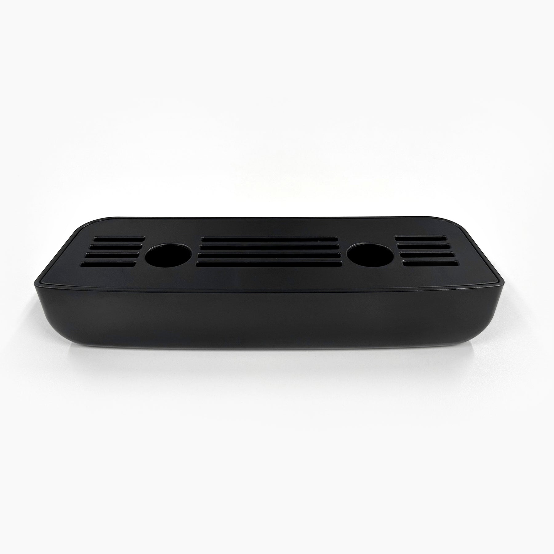 The Drip Tray and Cover 320S Black Slim Top Load is a black rectangular plastic tray with rounded corners, two circular holes, and multiple horizontal slits on top, designed for CLPOU320BSLUV2P, shown on a white background.