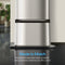 Close-up of the brushed stainless steel Water Cooler Base for Brio 430 Series Bottled & Bottleless Water Coolers with "Made to Match" text. Its durable finish perfectly complements your cooler. Blurred plants and furniture appear in the background.