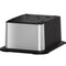 A modern, rectangular stainless steel and black power outlet tower from the Brio Moderna + ICE Series pairs seamlessly with your Water Cooler Base - 720 Series Ice Maker Bottled & Bottleless Water Cooler for a sleek, efficient workspace.