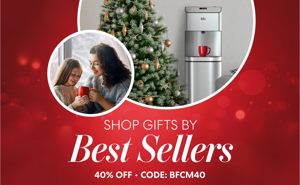 Holiday-themed Brio promotion with a red background. A decorated Christmas tree and Brio water dispenser with a red mug are shown beside a mother and daughter smiling while holding red mugs. Text reads “Shop Gifts by Best Sellers – 40% Off • Code: BFCM40.”