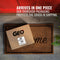 A GEO Porcelain Ceramic Crock Water Dispenser w/ Stand - Blue Stripe box sits on a doormat by a red door. Text above reads: Arrives in one piece. Our thorough packaging protects the porcelain ceramic water dispenser during shipping, ensuring your BPA-free hydration solution reaches you safely.