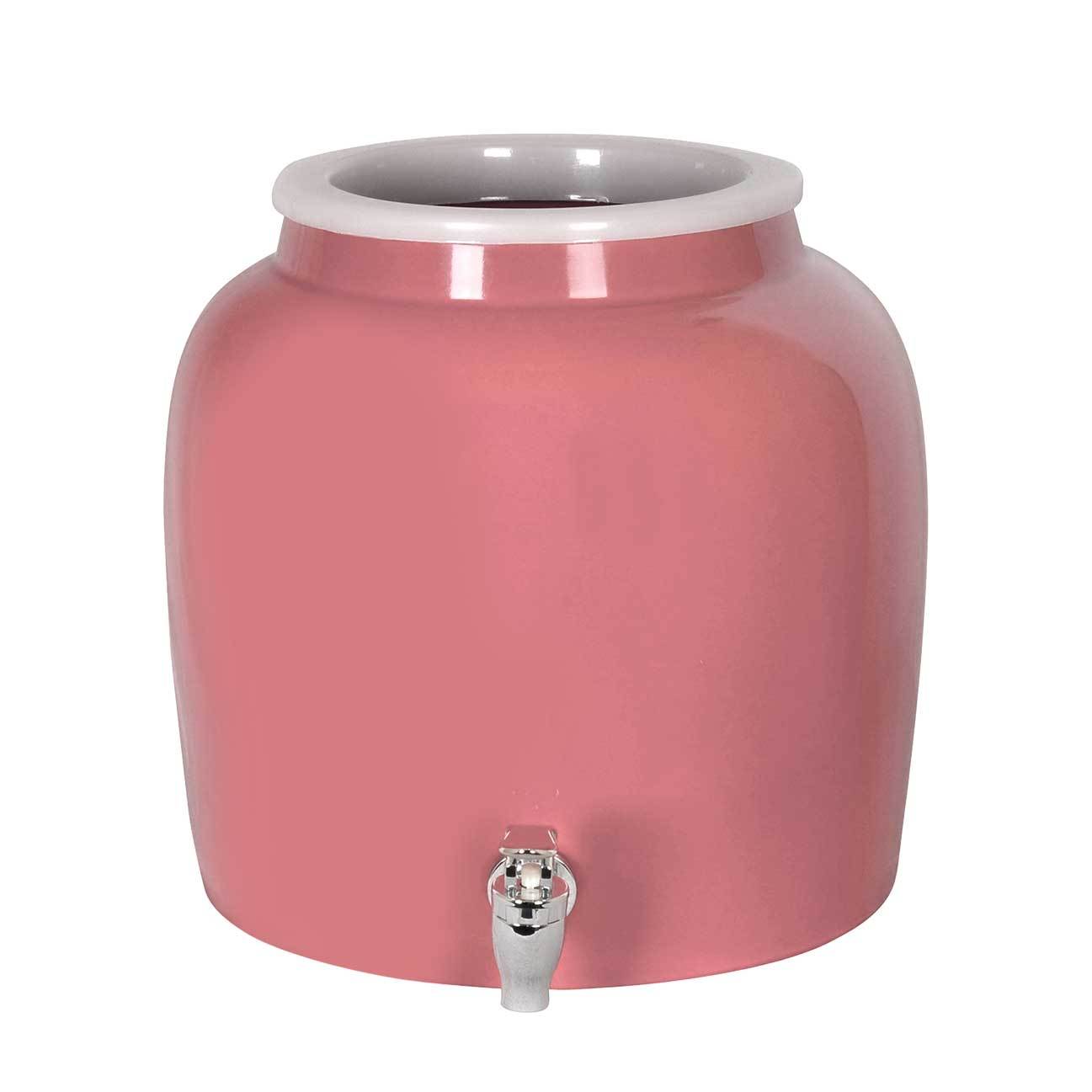 The GEO Porcelain Ceramic Crock Water Dispenser in pink features a white rim, silver spigot, and fits a 5-gallon water bottle, shown against a plain white background.