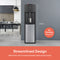 The Stainless Steel Bottom Load Water Cooler - 130 Series in black and silver stands in a kitchen as a glass fills. Text reads: 41.73 in, No Plumbing Required, Streamlined Design with brushed stainless-steel accent panel.