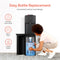 A woman kneels to load a 5-gallon bottle into the bottom of a black Bottom Load Water Cooler - 130 Series. Icons highlight: no heavy lifting, slide-in front, and fits 5-gallon bottles. Text reads: Easy Bottle Replacement.