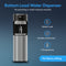 A Brio Bottom Load Water Dispenser - Model 420 in sleek silver stainless steel is featured dispensing water into a glass, showcasing its easy-to-use bottom load design and sturdy construction. This tri-temperature dispenser provides three customizable temperature options and removes the hassle of lifting heavy bottles. The scene is set against a blue background with white text.