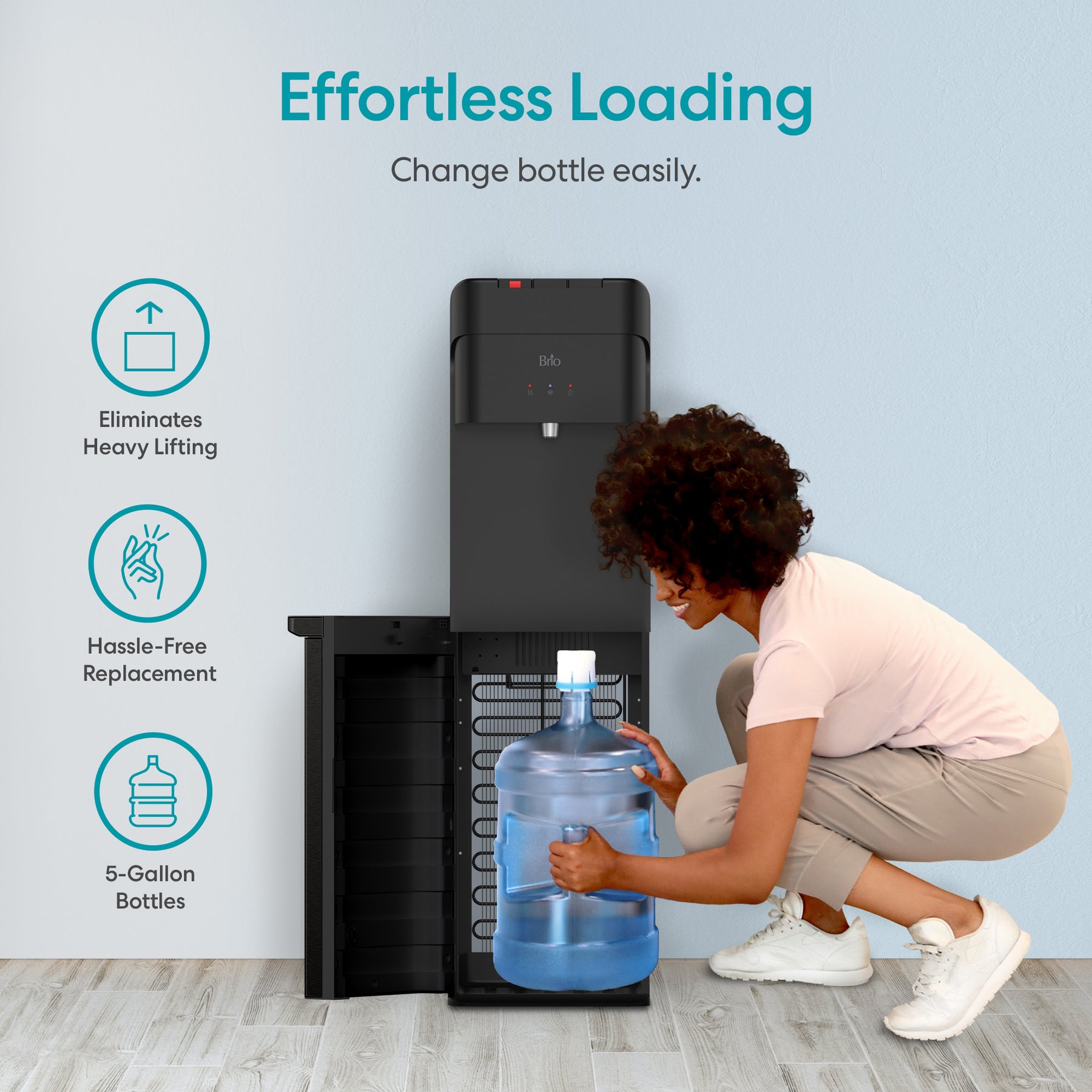 A person easily loads a 5-gallon bottle into the Brio 425 Tri-Temperature Black Bottom Load Water Cooler. Text highlights Effortless Loading, Eliminates Heavy Lifting, Hassle-Free Replacement, and use with 5-Gallon Bottles.