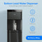 The Black Stainless Bottom Load Water Dispenser - Moderna 720 fills a glass, showcasing its features: convenient bottom load design, three temperature settings, automatic ozone self-cleaning, no plumbing required, and no heavy lifting. This self-cleaning water cooler combines modern style and convenience for any space.