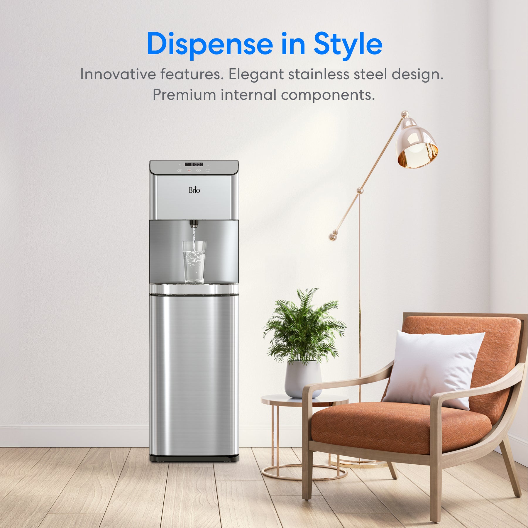 A Brio Moderna Self-Cleaning Bottom Load Water Cooler is showcased in a chic room with a brown chair, white pillow, potted plant, and floor lamp. The text above says “Dispense in Style” with a brief product description below.