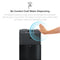 A hand hovers over the Touchless 3-Stage Black Stainless Countertop Water Cooler - Moderna Series, activating its sensor technology. Blue lines highlight the advanced filtration system’s touch-free cold water dispensing feature.