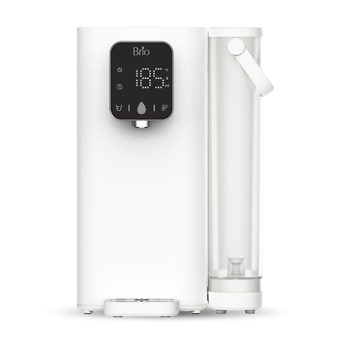 The Brio SIMPL 3-Stage Dual Temp Countertop Water Dispenser features a refillable tank, digital display reading "185", touch buttons, center spout, and a transparent side reservoir with handle—delivering sleek design and convenience.