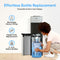 A woman loads a large water bottle into the Bottom Load No-Line Water Filtration Dispenser - Model 520. Text highlights effortless bottle replacement, eliminates heavy lifting, offers hassle-free replacement, and is compatible with both 3- and 5-gallon bottles. The Bottom Load No-Line Water Filtration Dispenser - Model 520 makes staying hydrated simple and convenient for any household.