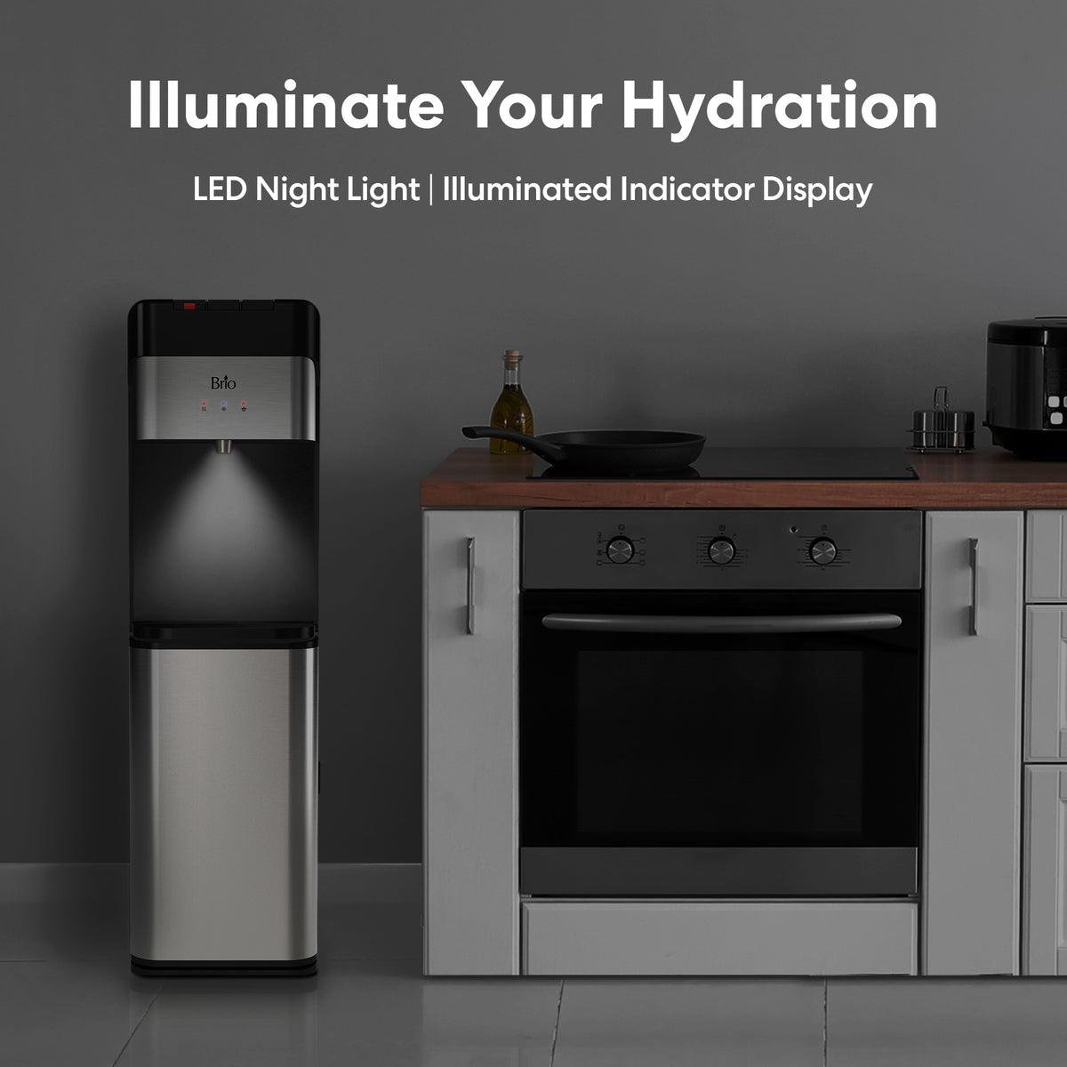 A 3-Stage Bottleless Water Filtration Dispenser - 430 Series with LED night light and illuminated indicator display stands next to a kitchen counter and oven, offering advanced 3-stage filtration. Above, the text “Illuminate Your Hydration” and “LED Night Light | Illuminated Indicator Display” showcase its modern design.
