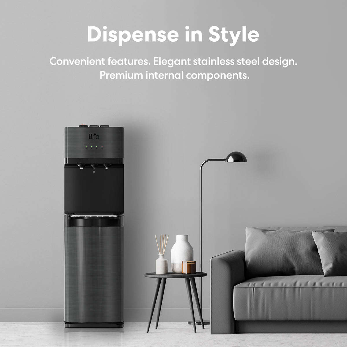 A modern living room featuring a gray sofa, a floor lamp, a side table with books and a plant, and the Black Stainless Ultrafiltration Bottleless Water Dispenser - 520 offering advanced water filtration—all set against a light gray wall with promotional text displayed above.