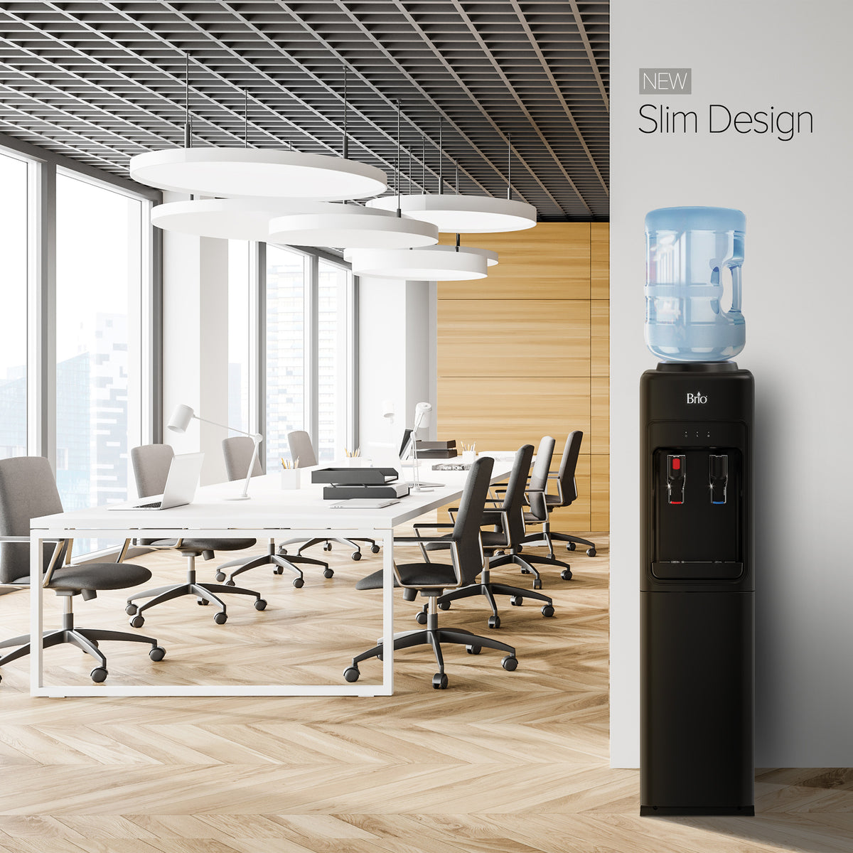 A modern office with white desks and chairs, large windows, and a sleek Black Top Load Water Cooler - 320 Slim Series featuring blue and red taps. Text reads NEW Slim Design.