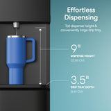 A blue travel mug fills from the Brio 530 Series Hot & Cold Top Load Water Cooler, featuring a 9-inch dispense height, 3.5-inch drip tray depth, easy hot and cold water dispensing, and a convenient child safety lock.