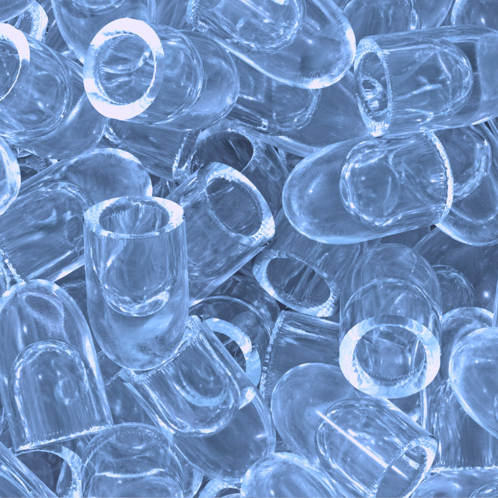 Smooth, hollow bullet ice cubes that maximize surface contact for rapid, efficient cooling.