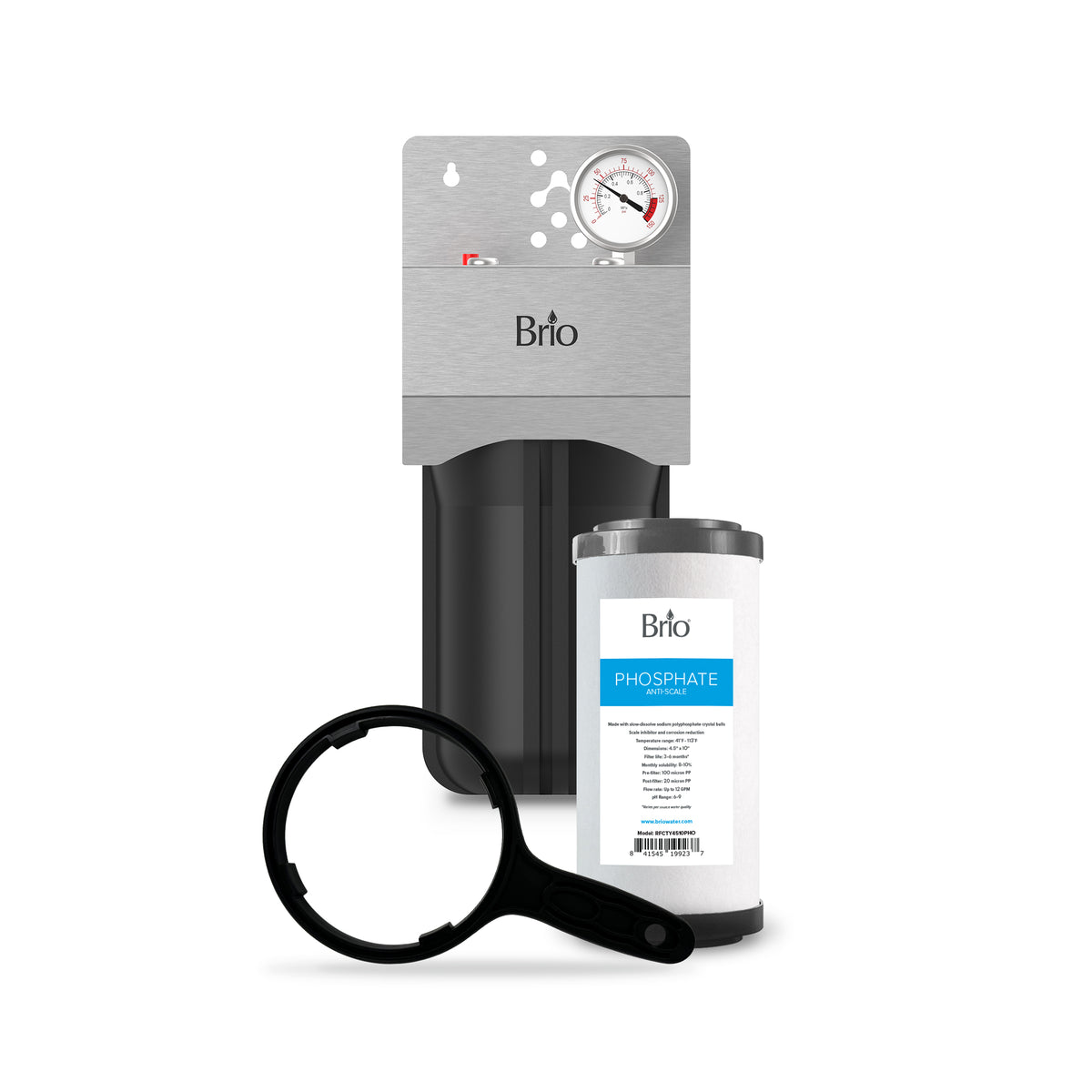 The Single Stage Whole House Filtration System - 10" Anti-Scale includes a pressure gauge, black filter housing wrench, and replacement phosphate cartridge, shown in front for effective hard water treatment.