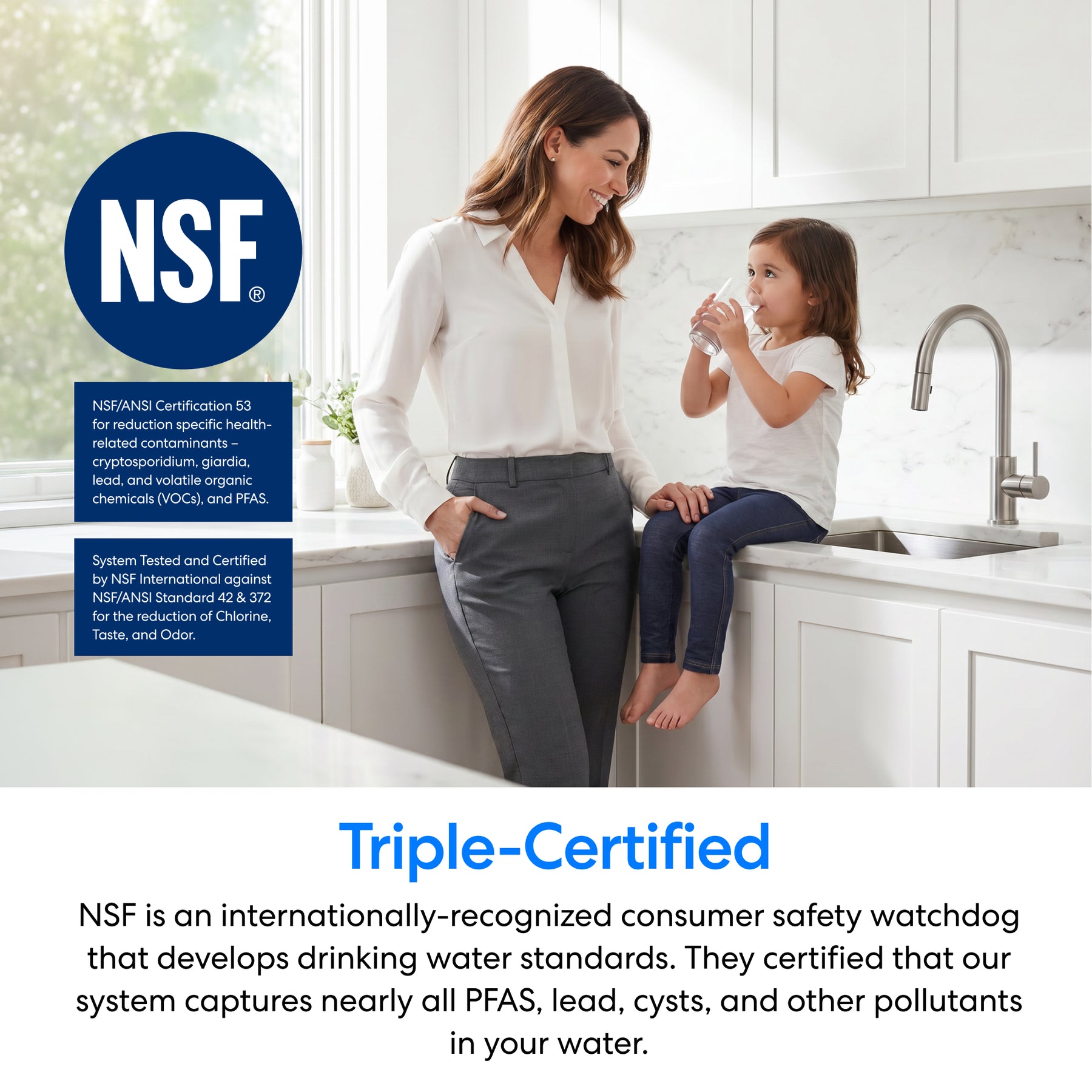 A woman smiles at a young girl sipping water in the kitchen, highlighting the 16" Premium Under Sink Filter PFAS-Removal System & Faucet for safe, NSF certified, clean drinking water with effective PFAS removal.