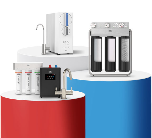 Display of three Brio water filtration systems on red, white, and blue cylindrical platforms, including undersink systems, a tankless RO system, and a whole house filtration system, shown on a transparent background.