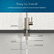 Diagram illustrating the installation of the Modern Series Water Faucet-31mm Brushed Nickel with labeled parts: rubber washer, locking nut, 4" threaded shank, locking clip, 1/4" quick connect, and 1/4" PE tubing on a white tile backsplash.