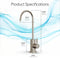The Modern Series Water Faucet-31mm Brushed Nickel is displayed with dimensions: height 10.43" (26.5 cm), reach 4.92" (12.5 cm), base height 2.83" (7.2 cm), and width 1.22" (3.1 cm) against a blue wave background.