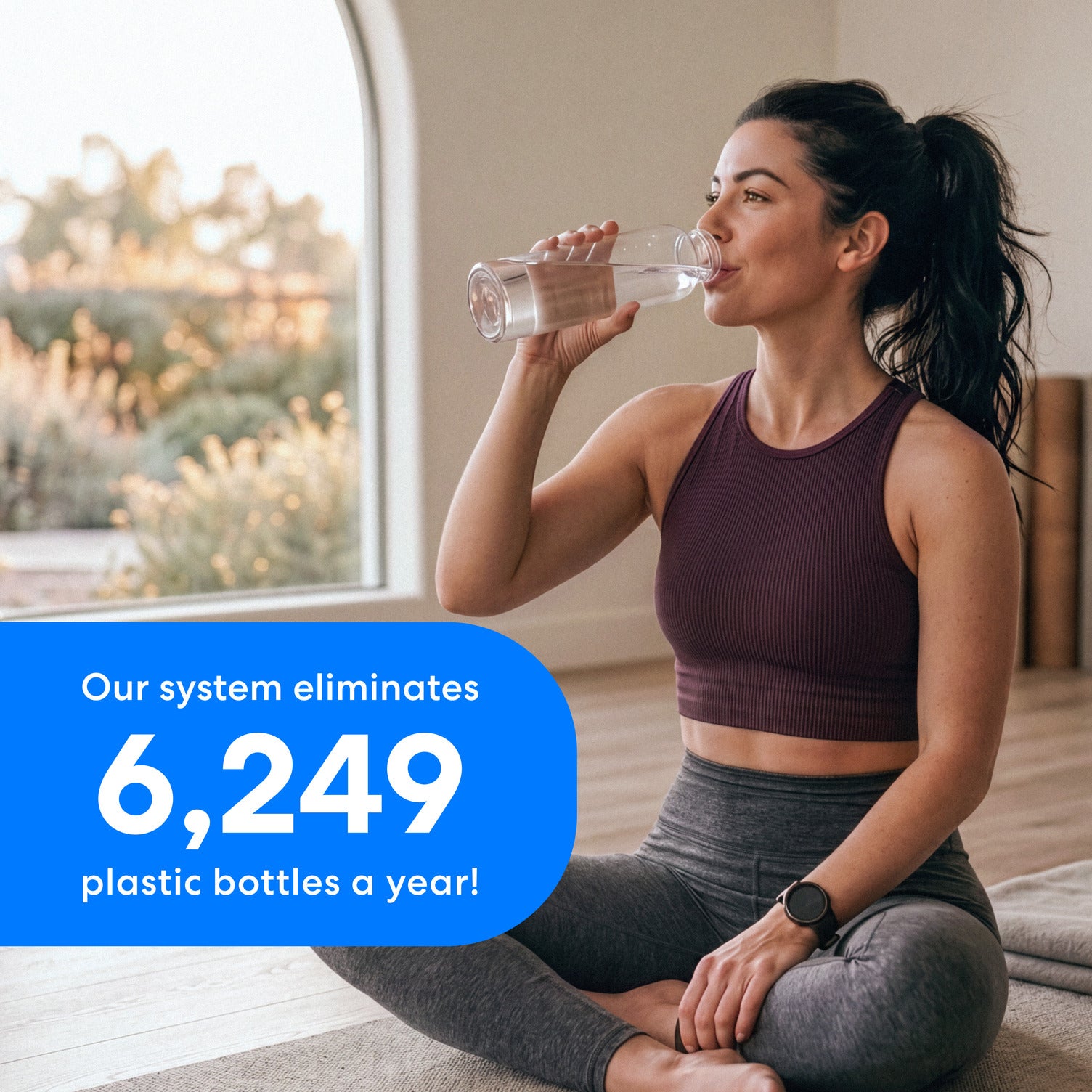 A woman in workout clothing sits on the floor drinking water. Text emphasizes the 11" Premium Under Sink Filter (825 Gallon Capacity), NSF certified system replaces 6,249 plastic bottles annually.  This information is on a blue background with white text.