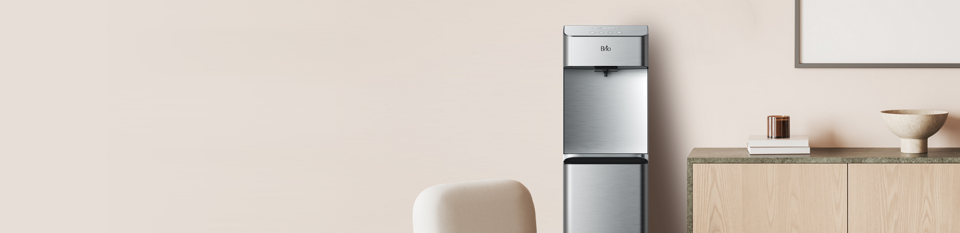 A modern water dispenser stands next to a light wood cabinet with minimalist decor, including a vase, a cup, and a picture frame, against a beige wall.