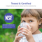 A young girl drinks water from a glass outdoors. Text reads, “Tested & Certified. The AQUUS Series Tankless RO Under Sink Filtration System 1200GPD is independently tested to reduce harmful contaminants—delivering reliable filtration for your home.” An NSF logo and certification information are also visible.