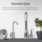 Modern kitchen sink featuring two sleek stainless-steel faucets, stylish bowls, a potted olive tree, and the compact Ultrafiltration Under Sink Filtration System – Amphora Series, set against a white tile backsplash.
