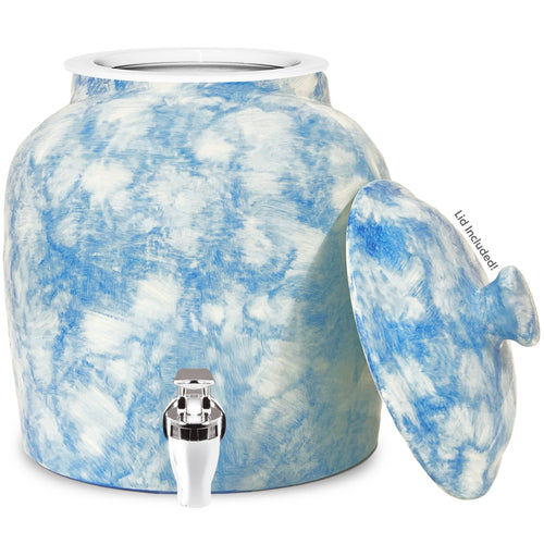 The GEO Porcelain Ceramic Crock Water Dispenser in Baby Blue Marble features BPA-free ceramic, a shiny silver spigot at the front, and comes with a matching lid labeled "Lid Included.