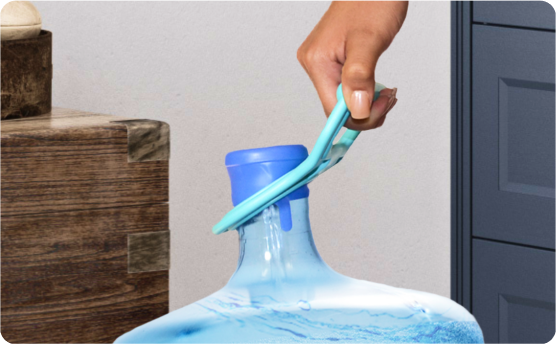 Close-up of a hand using a blue plastic tool to remove the seal from the cap of a large blue water jug.
